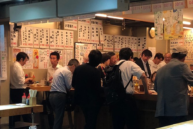 Private Tokyo Food Tour - Retro Akabane Izakaya Experience - Stop 3: grilling seafood and ending with a full plate