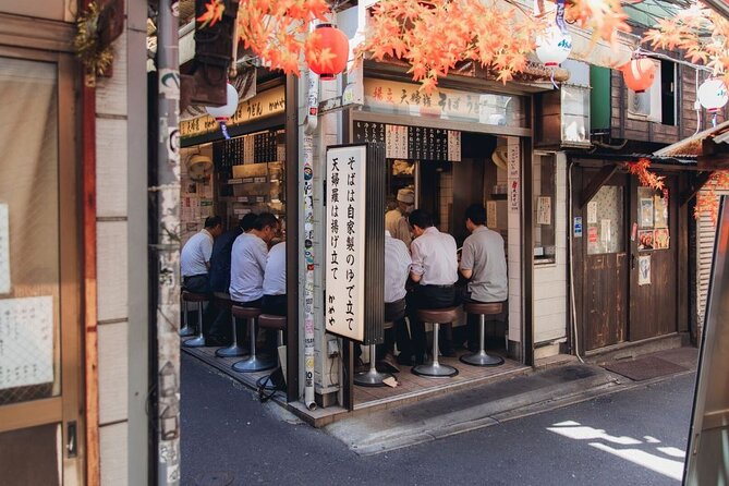 Tokyo After 5: Authentic Japanese Food & Drink Night Tour - Ginza After 5: Mitsukoshi, the Lion statue, and the pace check