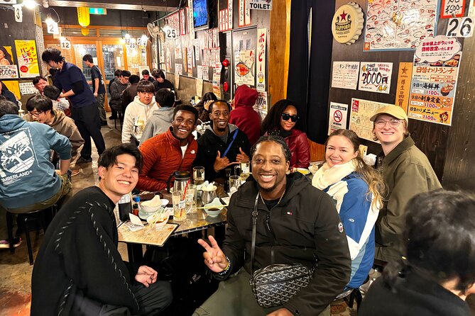 Tokyo: Shibuya Authentic Food Tour & Local Delights - Getting started at Shibuya Tsutaya and the quick Hachiko landmark moment