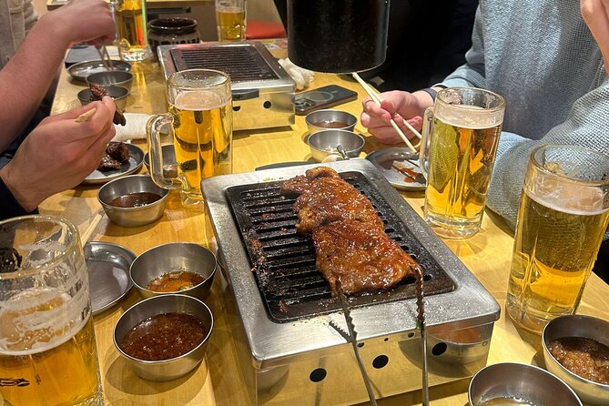 Tokyo: Shinjuku Bar Hopping & Night Walking Tour - What You’ll Eat and Drink: Sushi, Kushikatsu, Gyoza, and Sake Pairings